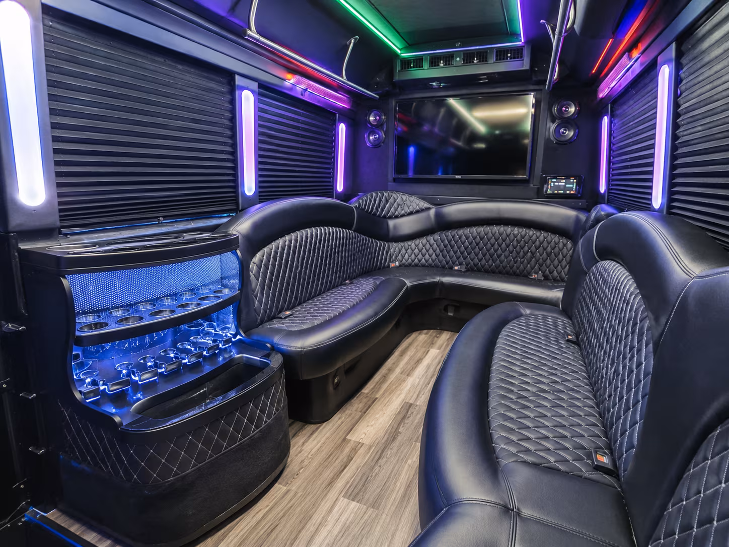 Group beside a Mercedes Sprinter limo in Oakland