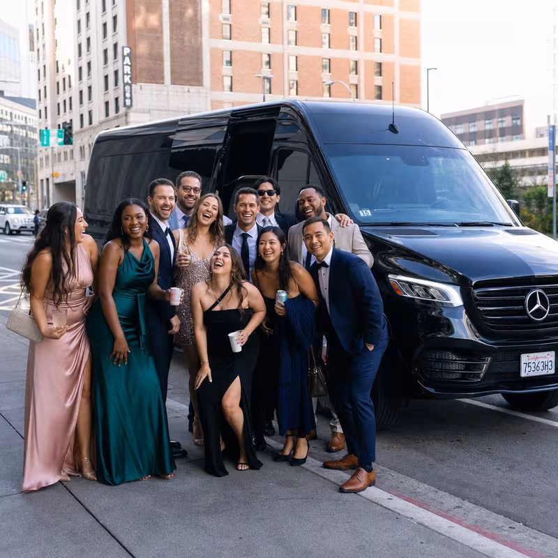 Group boarding a white charter bus for Bachelor & Bachelorette Transportation transportation in Oakland