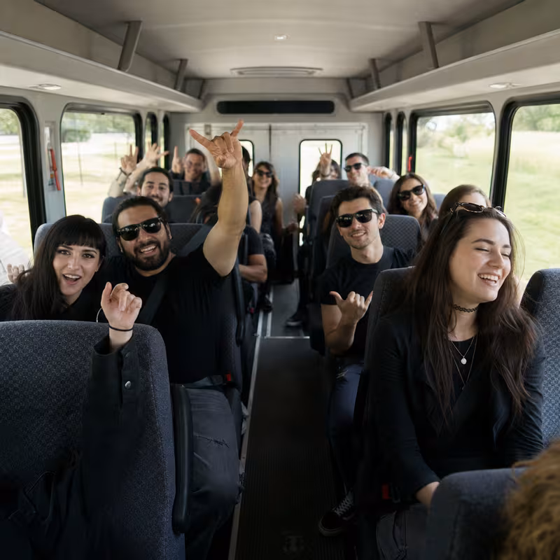 Party bus interior with wraparound leather seating and LED lighting in Oakland