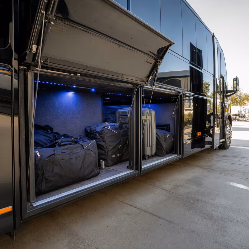 Party bus interior with wraparound leather seating and LED lighting in Oakland