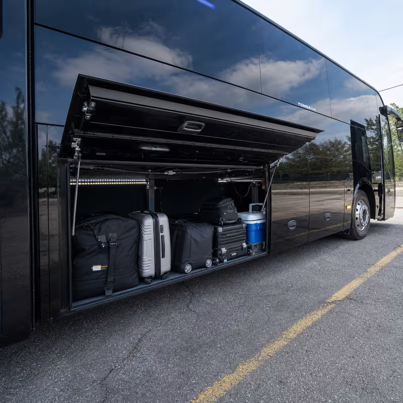 Party bus interior with wraparound leather seating and LED lighting in Oakland