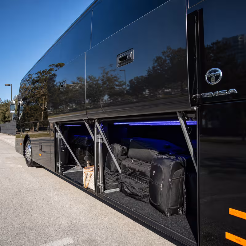 Party bus interior with wraparound leather seating and LED lighting in Oakland